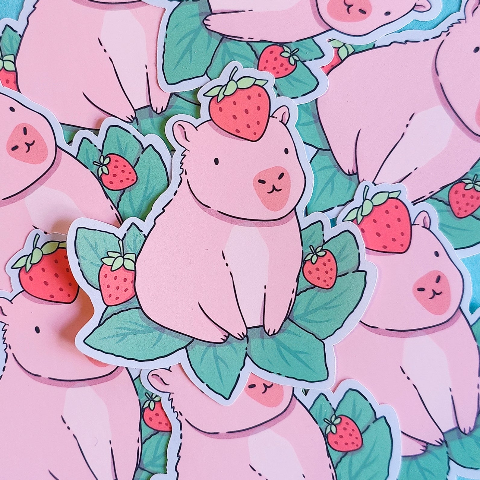 Matte vinyl die-cut sticker featuring a cute capybara with a strawberry on its head – Capyberry kawaii-style artwork printed in Ireland, 8x9cm.