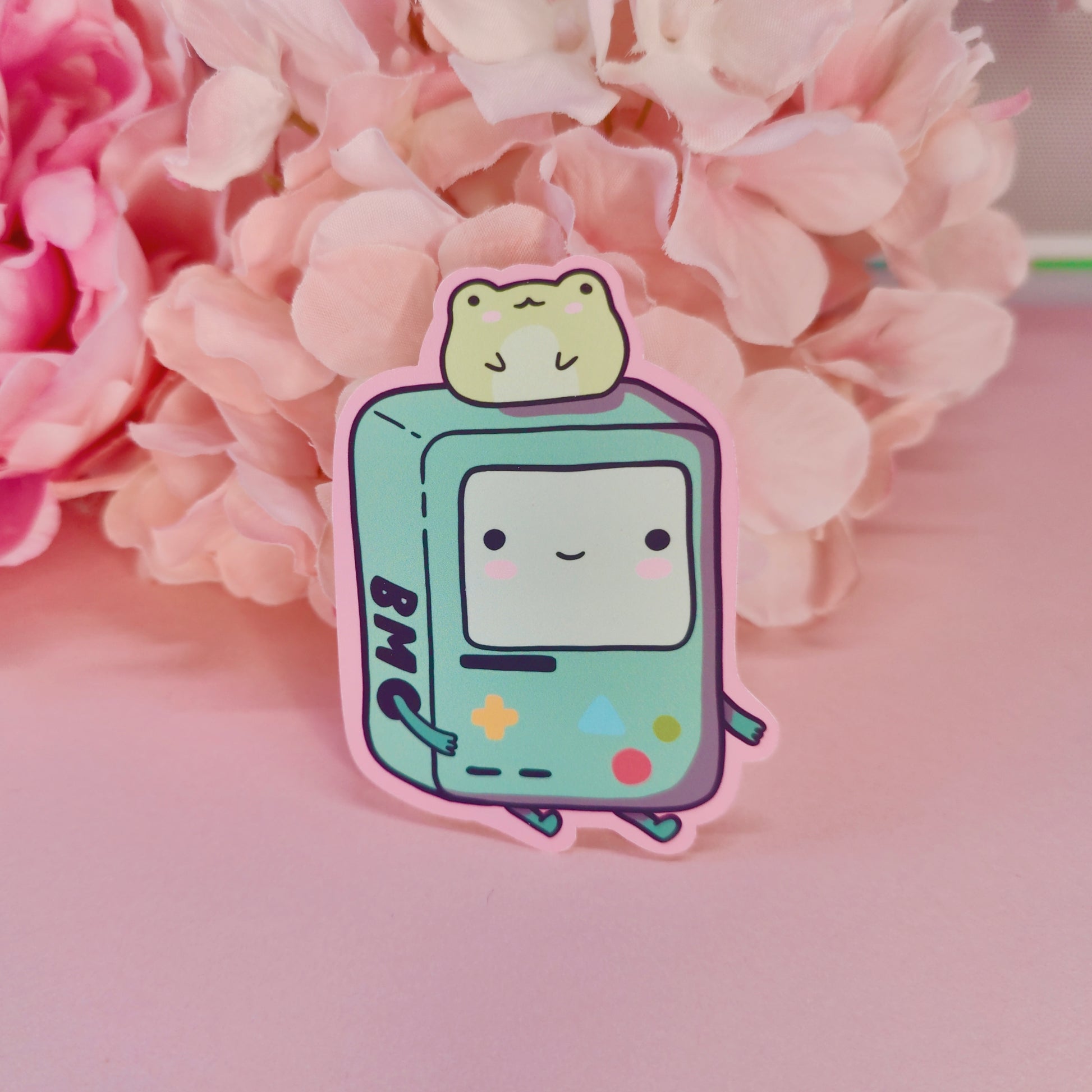 Matte vinyl die-cut sticker featuring a kawaii BMO-inspired character with a frog on his head, printed in Ireland, 5x7cm