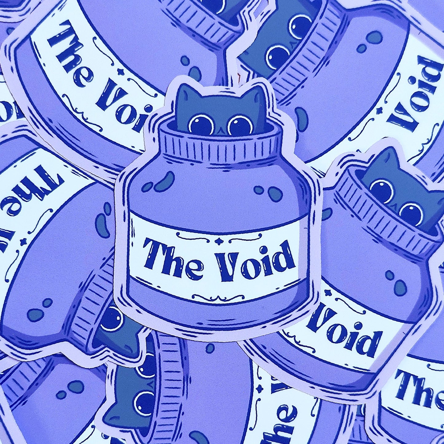 Matte vinyl die-cut sticker featuring The Void – a black cat peeking out from an ink bottle, printed in Ireland, 5x7cm