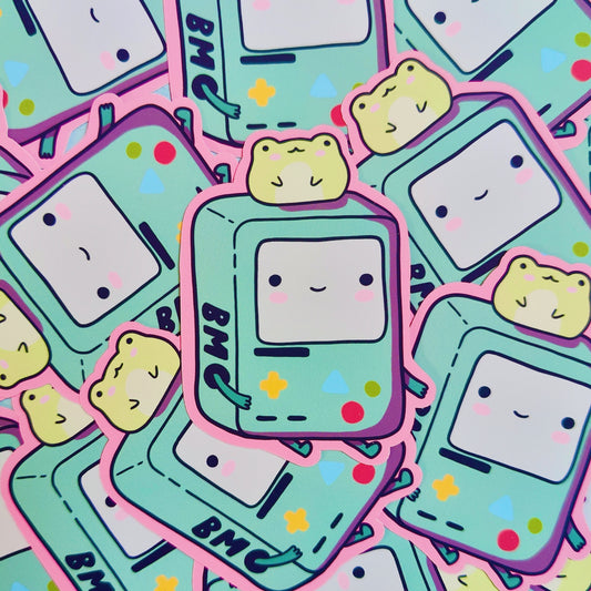 Matte vinyl die-cut sticker featuring a kawaii BMO-inspired character with a frog on his head, printed in Ireland, 5x7cm