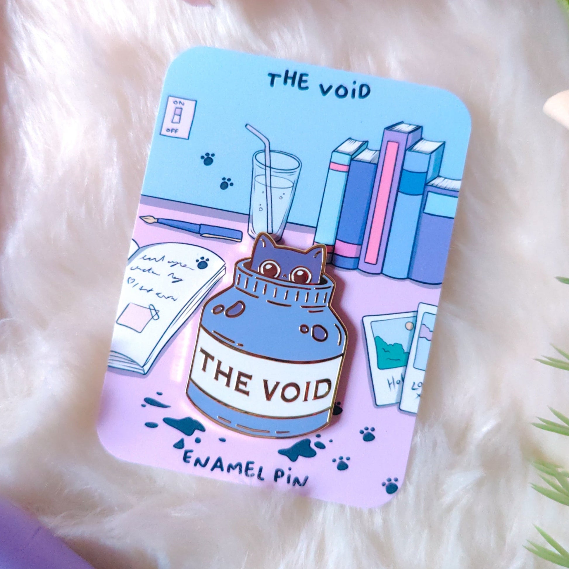 Enamel pin with 'The Void' design on a fluffy white surface, free Irish shipping, gold enamel cute pin Ireland
