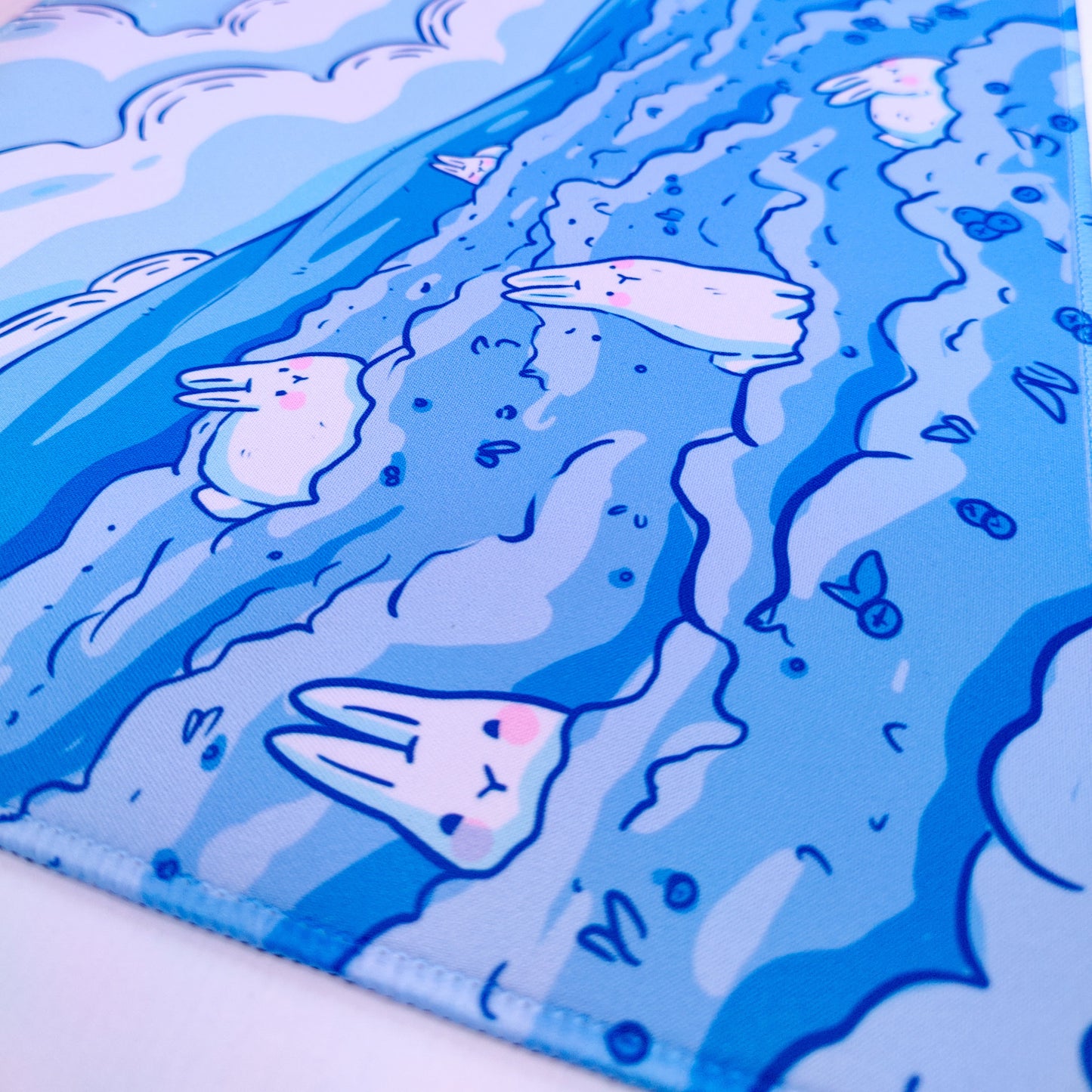 Decorative mat with cartoon bunny design on a blue and white background