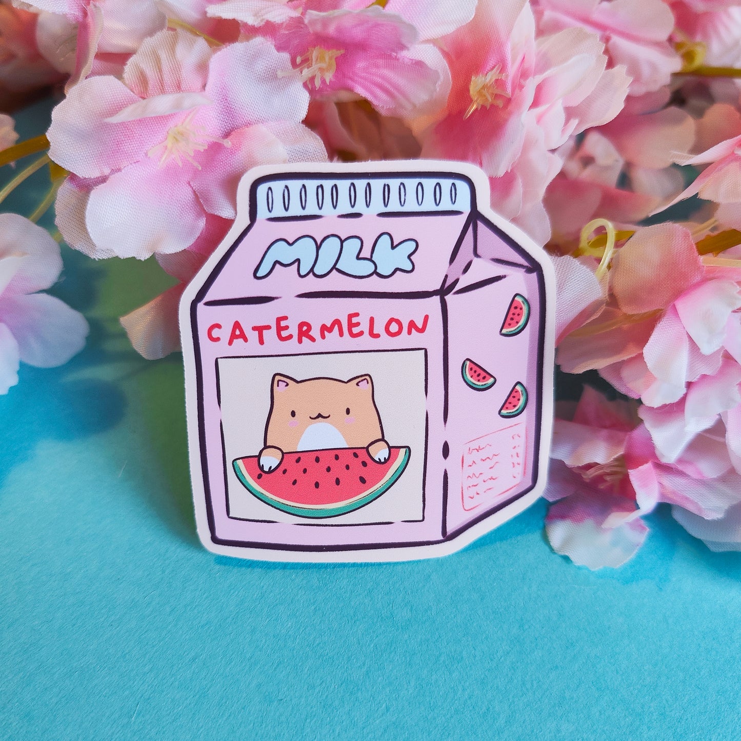 Matte vinyl die-cut sticker featuring Catermelon – a kawaii-style watermelon milk carton with a cute cat face, printed in Ireland, 6x6.5cm