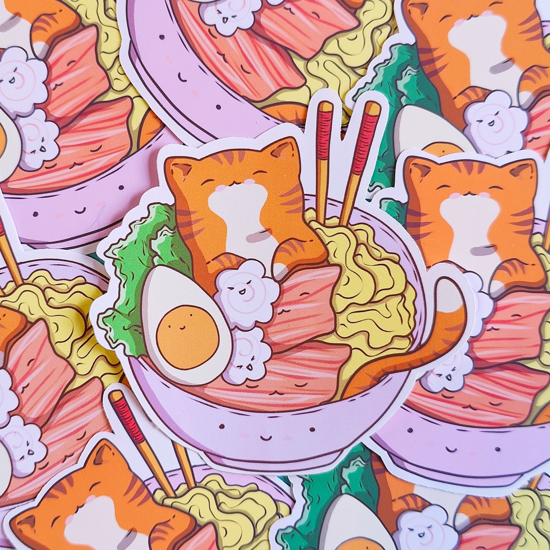 Cute die-cut matte vinyl sticker featuring a ginger cat bathing in a bowl of ramen – original kawaii artwork printed in Ireland, 8x8cm