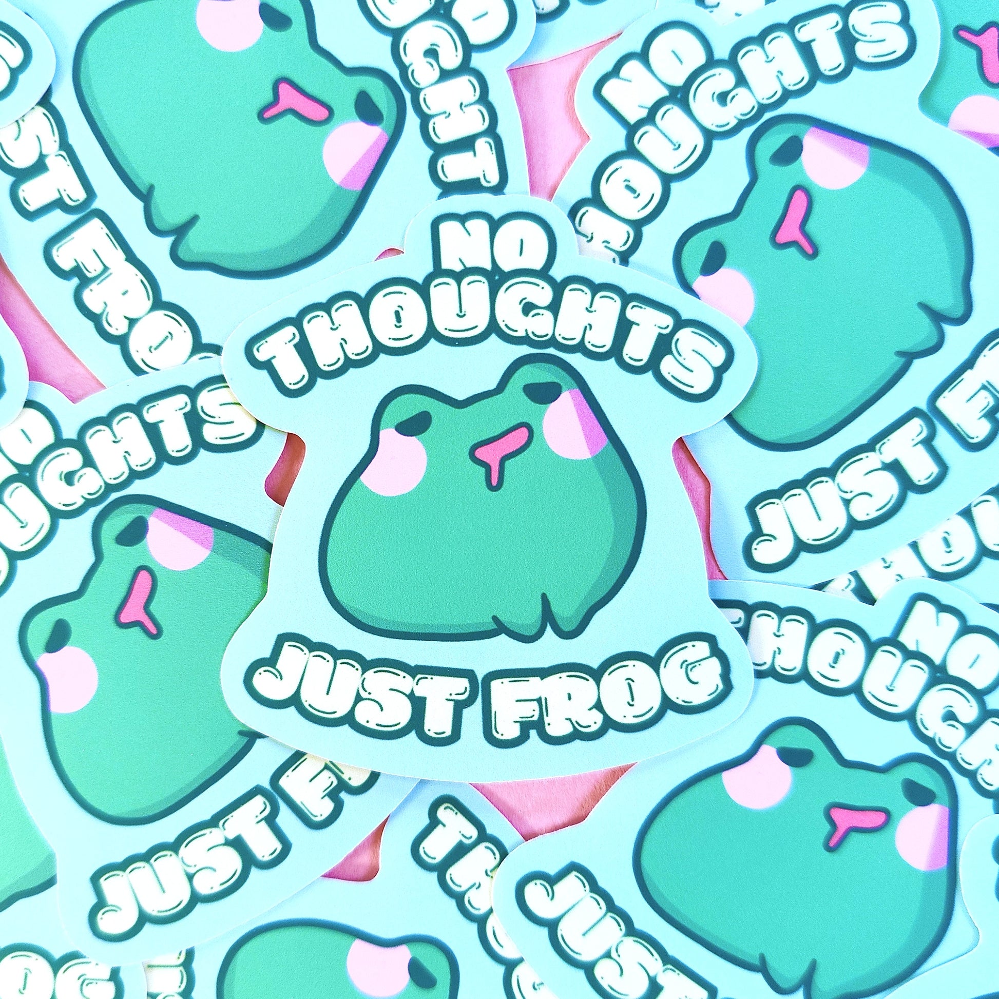 Matte vinyl die-cut sticker featuring No Thoughts Just Frog – a blank-faced, kawaii frog character, printed in Ireland, 5x7cm