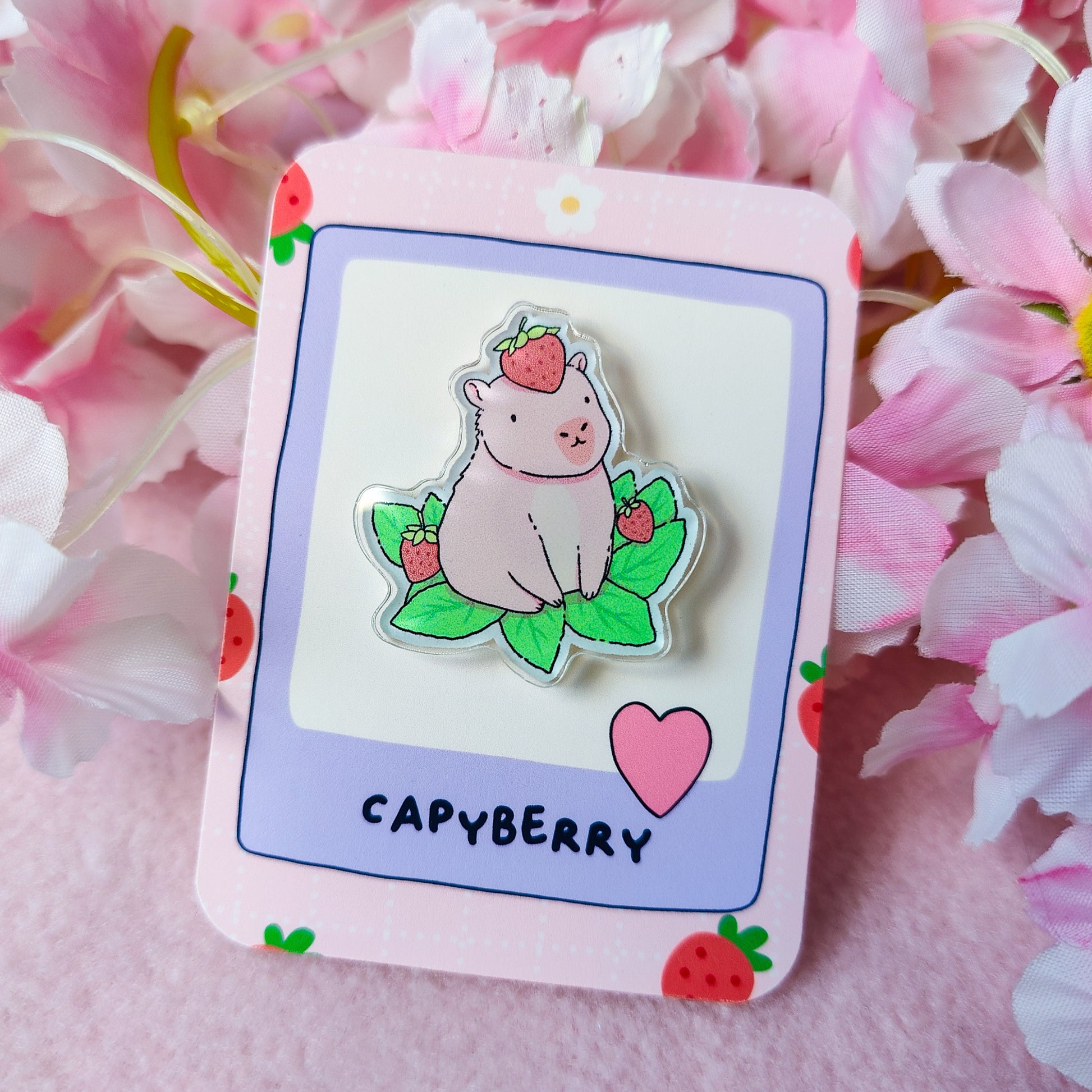 Capyberry acrylic pin – cute capybara with strawberry on head, on art backing card