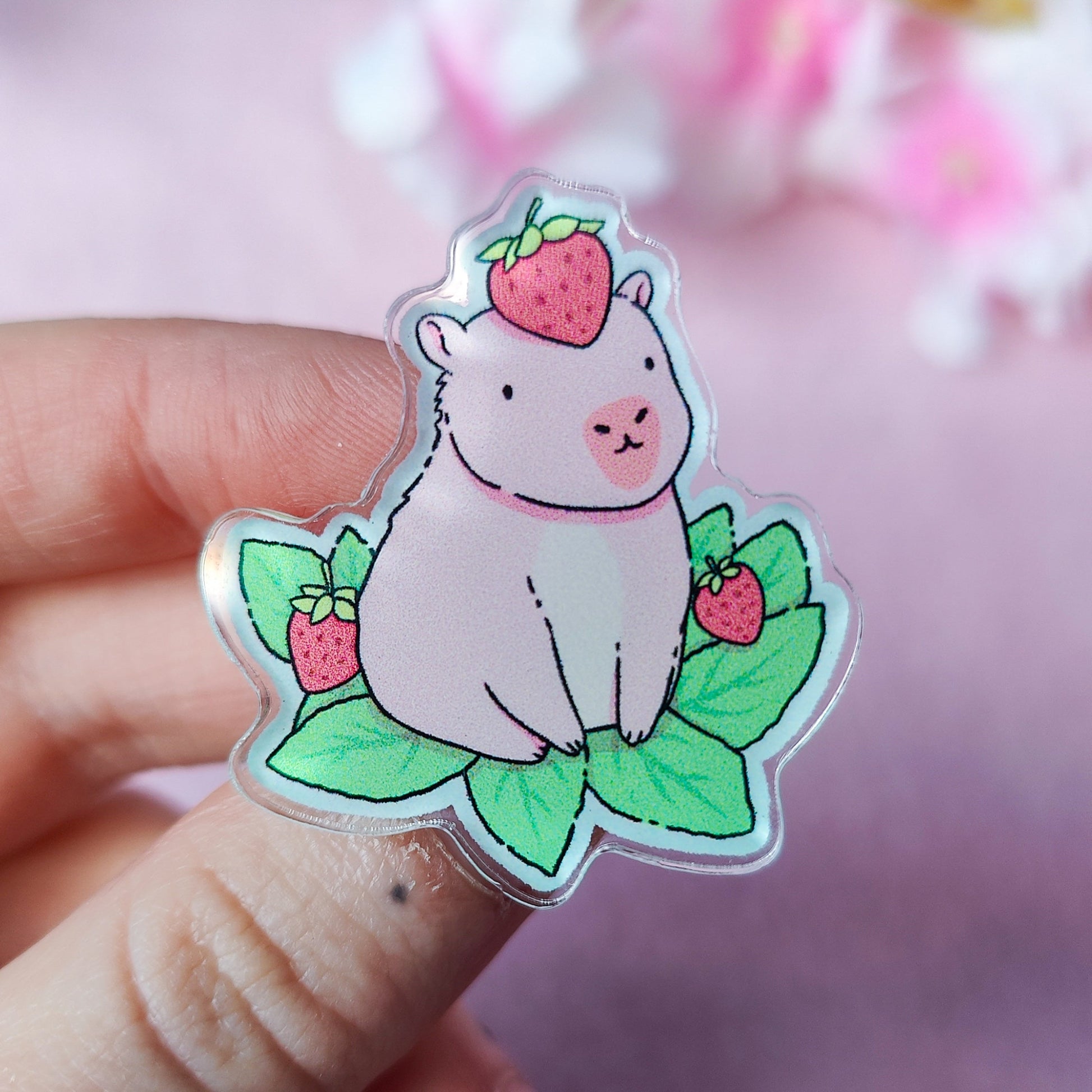 Capyberry acrylic pin – cute capybara with strawberry on head, on art backing card